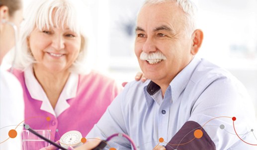 Senior couple checking blood pressure at home